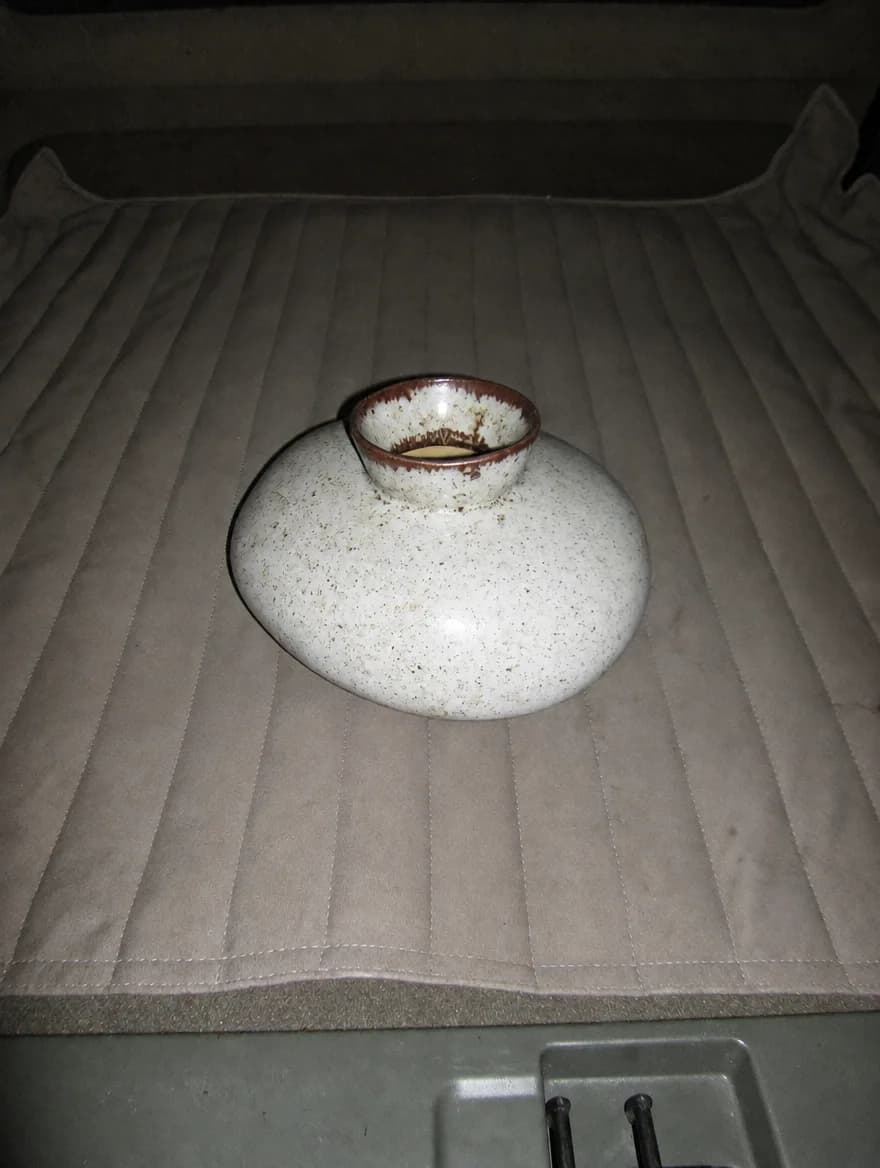 A speckled white pebble vase
